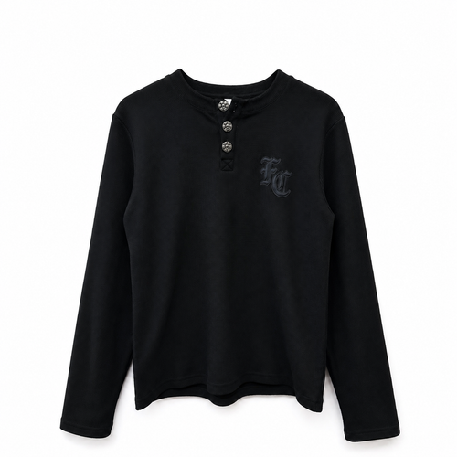 A black long-sleeve henley shirt with a three-button placket and a dark gray embroidered 'FC' logo on the left chest, displayed against a plain white background.
